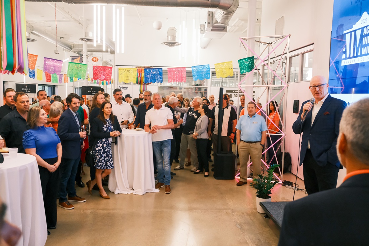 AIM Summit welcome event with founders, military medical innovation leaders, and partners